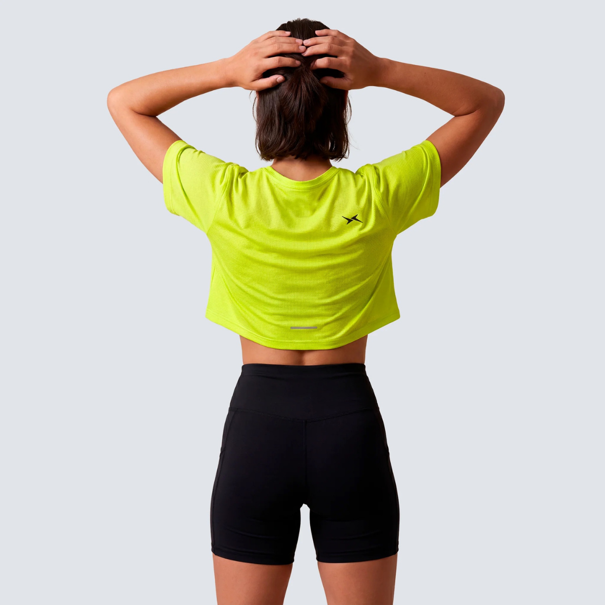 Camisola Crop Performance SS26